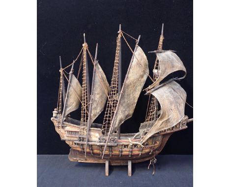 A WOODEN MODEL OF COLUMBUS' SHIP 'PINTA' in full sail, 80cm long, 62cm high