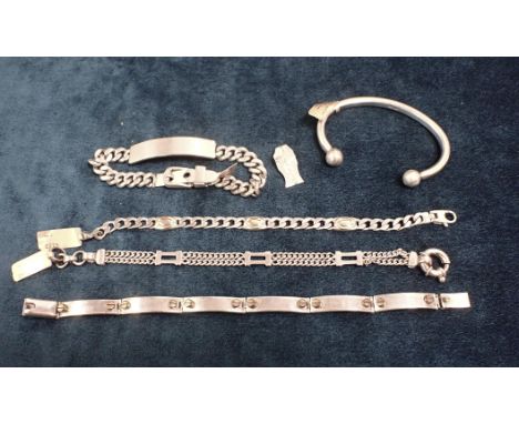 A SILVER IDENTITY BRACELET three other silver bracelets and a silver bangle (c.5.22oz total weight) (5)