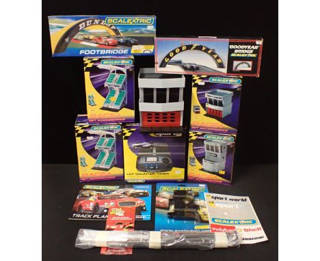 A COLLECTION OF SCALREXTRIC BUILDINGS AND ACCESSORIES plus a lap timer etc.