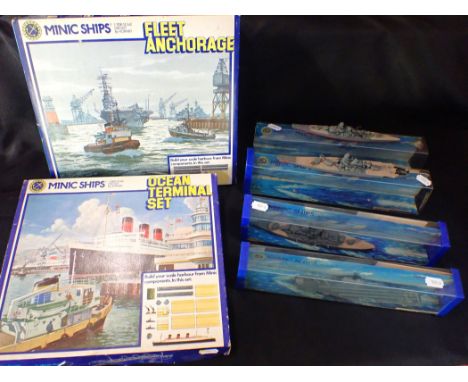 MINIC: A BOXED 'FLEET ANCHORAGE' SET, 'OCEAN TERMINAL' SET boxed, and four 1:1200 scale Minic battleships (the latter plastic