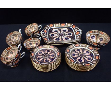 A ROYAL CROWN DERBY IMARI PATTERN PART TEA SERVICE (7 cups, 8 saucers and plates, 2 cake plates, basin; all appear intact, so