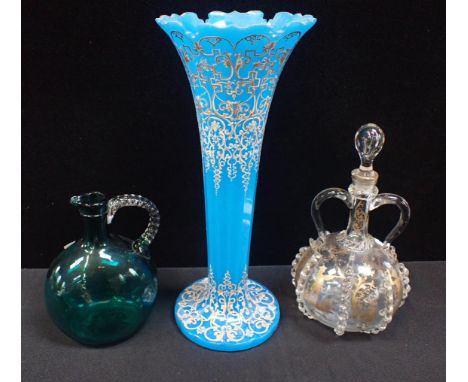 A 19TH CENTURY BOHEMIAN GLASS VASE of trumpet form, with painted and gilt decoration 36cm high (wear) a trailed decanter with