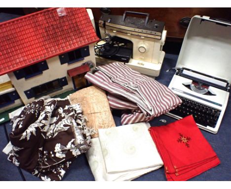 AN ITALIAN-MADE SINGER 358 SEWING MACHINE a 1970s doll's house, a Silver Reed typewriter, and a quantity of fabrics