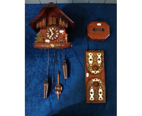 A MODERN SWISS CUCKOO CLOCK with a cased replica sundial compass and a Victorian bookstand. (3)
