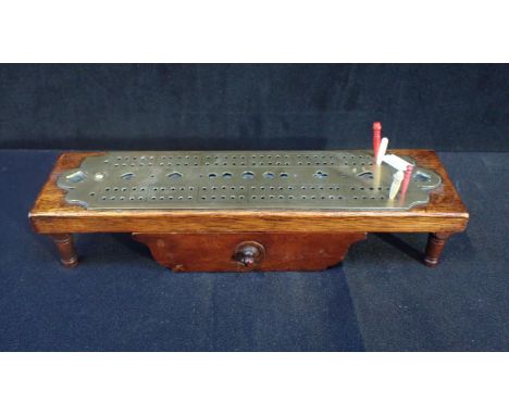 VICTORIAN BRASS AND OAK CRIBBAGE BOARD with added accessories drawer