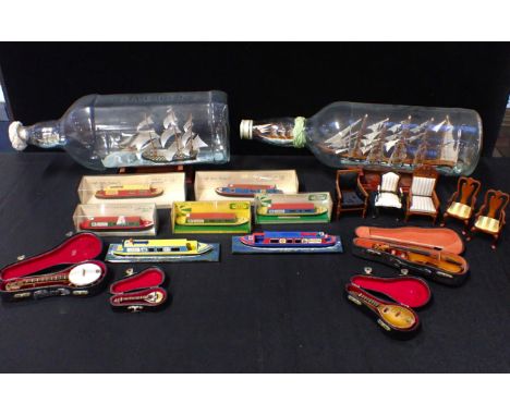 TWO LARGE SHIPS IN BOTTLES Cutty Sark and HMS Victory, with model canal boats, model musical instruments in cases and doll's 
