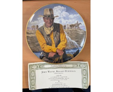 John Wayne, Rugged Horseman collector porcelain plate. This beautiful plate bears the original work of art by Robert Tanenbau