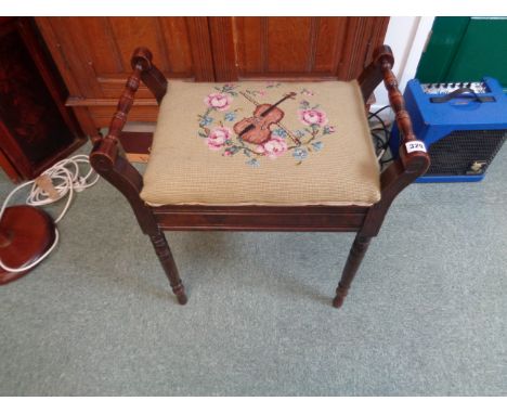 Edwardian Oak piano stool with turned supports and upholstered seat