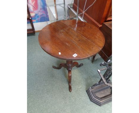 Georgian oak tilt top wine table of circular plank top above turned column stem and tripod legs, Condition - some light scrat