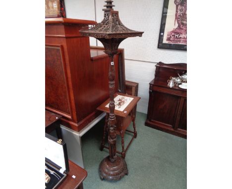 Highly carved Eastern Pagoda design standard lamp with figural decoration, 143cm in Height, Condition - Some restoration need