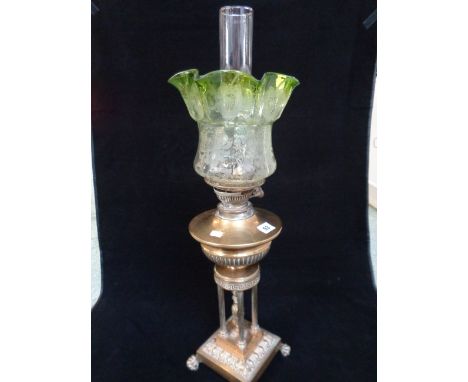 19thC Ornate Oil Lamp with column supports over paw feet with clear and glass frilled shade, 71cm in height total 