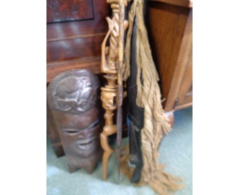 2 African Hardwood carved wall masks, Wooden carved stick and a Hunting Spear 