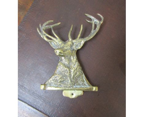 A Victorian brass door-knocker as a stag's head