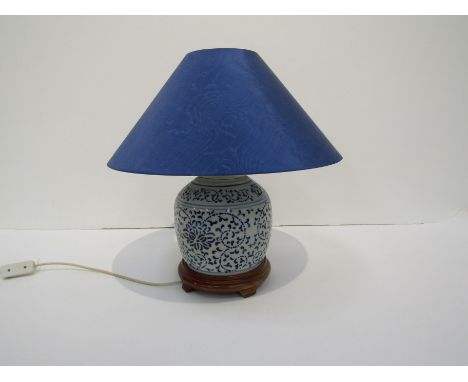 A modern electric table lamp in the form of a blue and white Oriental ceramic jar. A similar polychrome lamp (2 - with shades