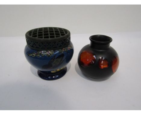 A Poole pottery black-ground vase decorated with shaded orange and red patches. 10.25cm tall. A Longpark, Torquay, blue groun