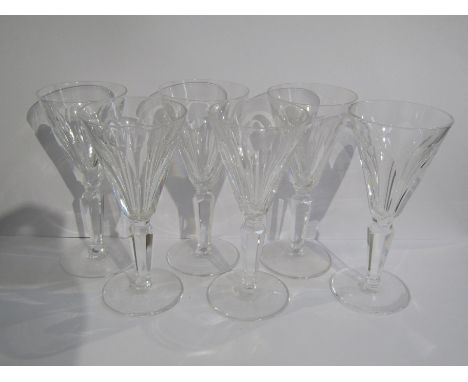 A set of six Waterford crystal sherry glasses with panel-cut conical bowls and stems