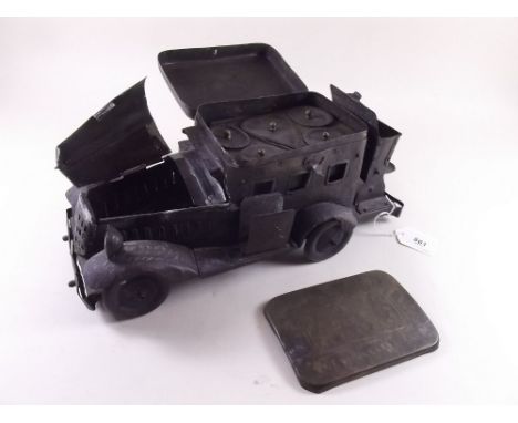 A novelty smokers compendium fashioned in brass as a 1930's automobile