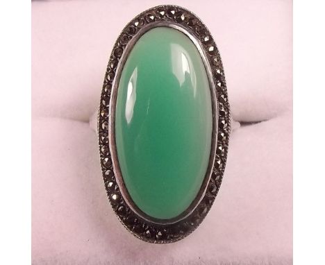 A silver 'jade' and marcasite oval ring 