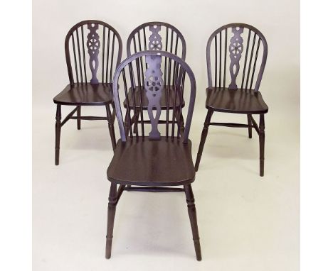 A set of six stick back dining chairs 