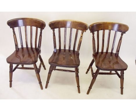 A set of six stick back dining chairs 