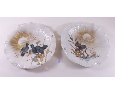 A Royal Worcester pair of oriental style plates decorated cranes and grouse 
