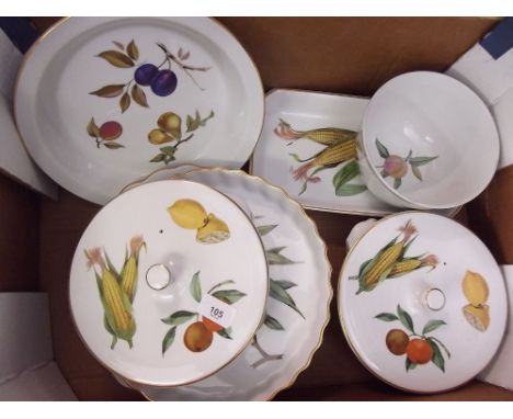 A quantity of Royal Worcester Evesham serving dishes comprising: two covered tureens, one pie dish, one flan dish, one oblong