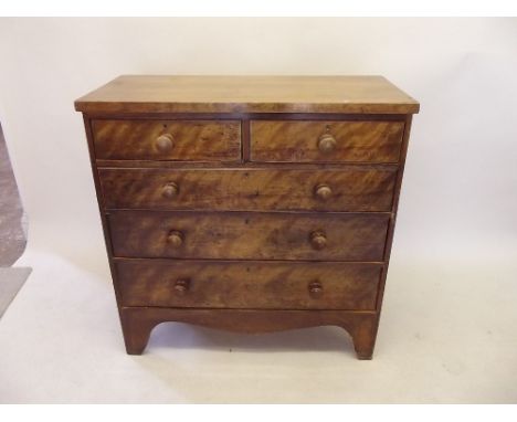 A Regency satinwood chest of two short and three long drawers on tall bracket supports 101 cm wide