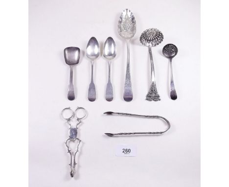 A silver fruit serving spoon, London 1798, sifter ladle London 1795, two Irish spoons, Georgian sugar nips etc. 