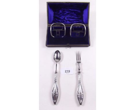 A pair of early 19th century steel shoe buckles and a silver Art Nouveau christening spoon and fork 