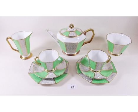 A Royal Stafford green and gilt tea service comprising: six cups and saucers, six tea plates, teapot, water jug, milk and sug