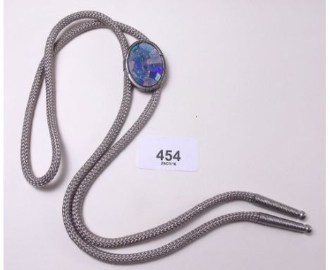 A silver framed opal doublet on bowler tie cord 