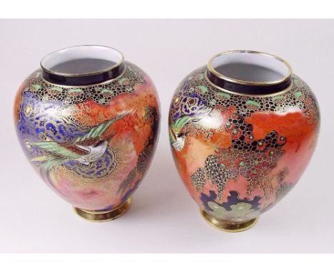 A pair of Carlton Ware vases painted 'Chinese Bird' pattern on an orange ground - 12cm