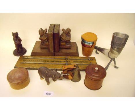 A collection of treen including bookends, two carved bears, pots with a set of titanium drinking cups in a leather case, a No