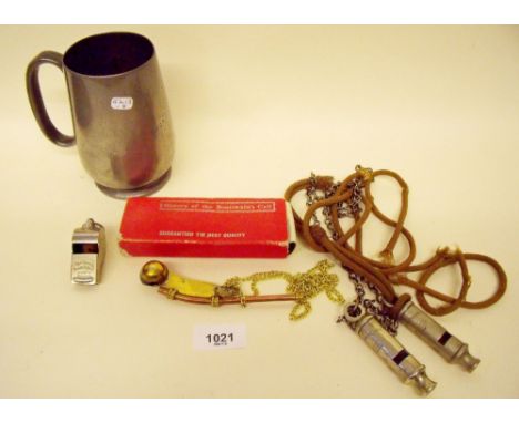 Two Metropolitan police whistles, an army whistle, a bosuns whistle and a Victorian pewter rowing tankard 