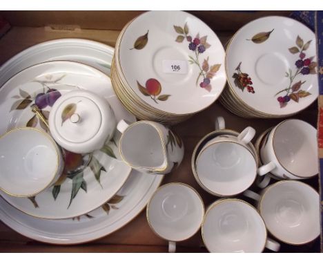 A Royal Worcester Evesham tea service comprising: one cake stand, eight tea cups and saucers, one milk, one sugar, one jam po