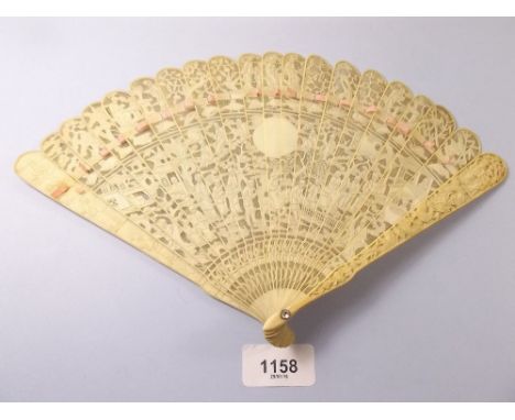A Chinese Canton ivory carved and pierced fan decorated figures in a garden - 19cm