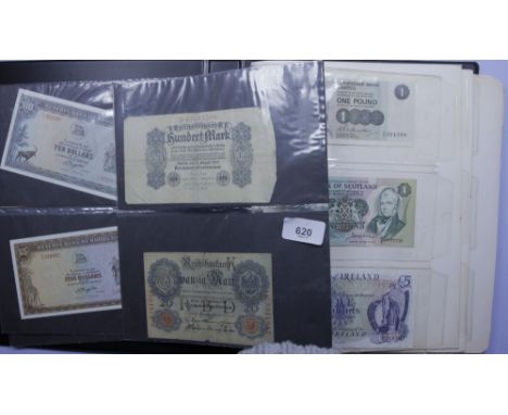 An album of world bank notes, approximately 40 including: Bank of England £5 prefix 82B, J S Fforde, 10 shillings prefix 04K,