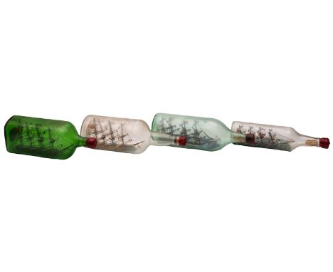 Four various model ships in bottles, including one of the clipper 'Sea Splendor'. 