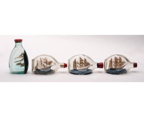Four various model ships in Dimple Haig bottles, including one of 'Herzogin Ceclie' clipper, all 20cm long.