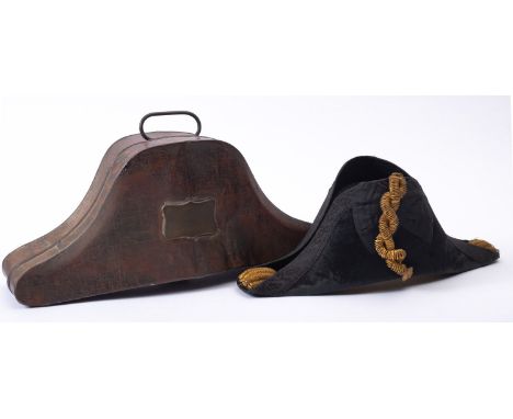 A 19th century Royal Navy Regulation bicorn hat,  the black felt skull with  embroidered trim and gilt  braid, white silk lin