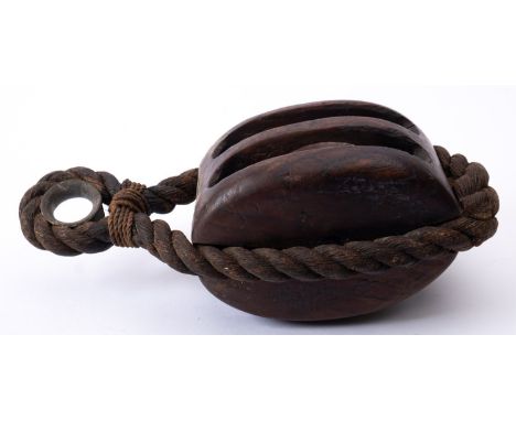 A 18th/ early 19th century century ship's block, with rope work strop,  one cheek stamped with broad arrow and numbered '8' t