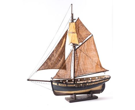 A scale model of the brig 'Martyr', fully rigged over a plank and pinned deck with  fitting , white gunwales with open gun po
