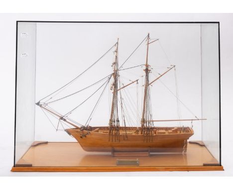 A cased scale model of  the Scottish two masted schooner 'Scottish Maid' by C Russell, standing rigged over simulated plank a