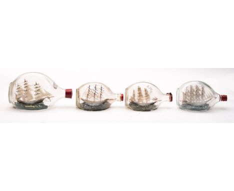 Four various model ships in Dimple Haig bottles, various sizes.