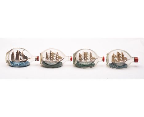 Four various model ships in Dimple Haig bottles, all 20cm long.