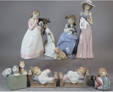 Collection of eight Nao Spanish porcelain figurines, mainly of young children with puppies and cats.  (8)   (B.P. 21% + VAT) 