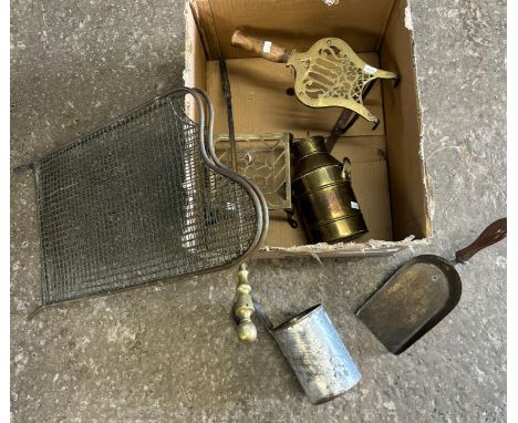 Box of metalware to include: trivet stands, folding mesh fire grate, measuring jug etc.  (B.P. 21% + VAT) 