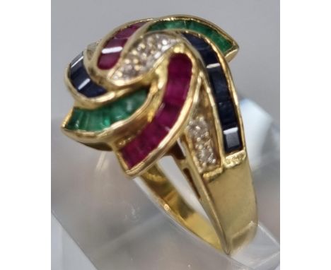 18ct gold modernist design ruby, sapphire, emerald and diamond ring, marked 750.  5.2g approx.  Size O.  (B.P. 21% + VAT) 