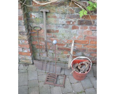 Scythe, old tools & a bucket of horse shoes