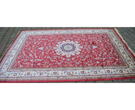 Red ground Kashmir carpet with a Shahbaz medallion design 300cm x 200cm